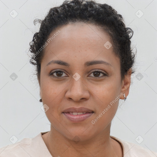 Joyful latino young-adult female with short  brown hair and brown eyes