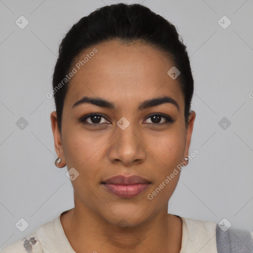 Joyful latino young-adult female with short  black hair and brown eyes