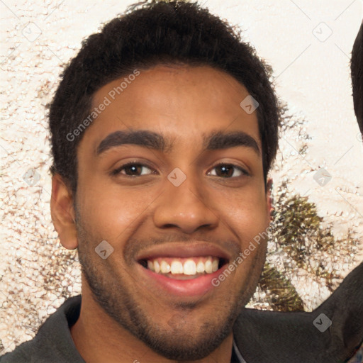 Joyful black young-adult male with short  brown hair and brown eyes