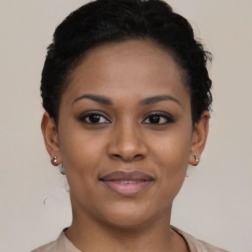 Joyful black young-adult female with short  brown hair and brown eyes
