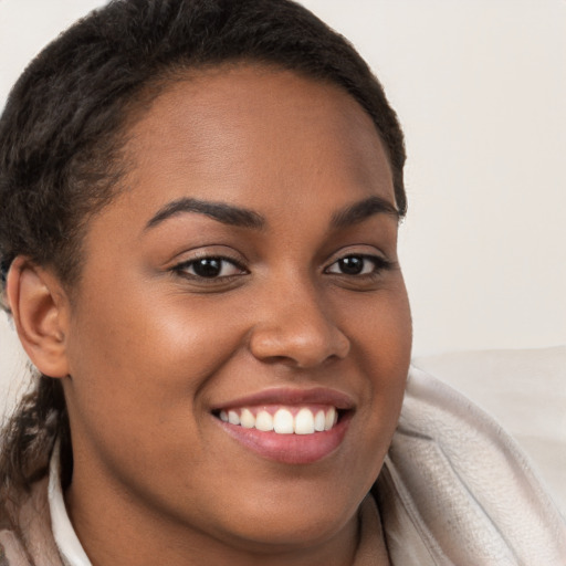 Joyful white young-adult female with long  brown hair and brown eyes