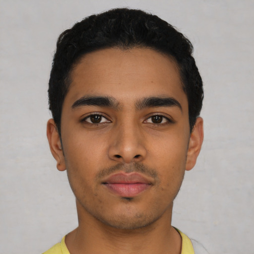 Neutral latino young-adult male with short  black hair and brown eyes