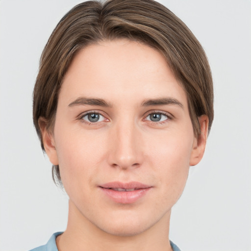 Joyful white young-adult female with short  brown hair and grey eyes