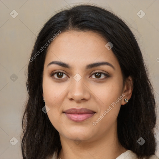 Joyful latino young-adult female with long  brown hair and brown eyes