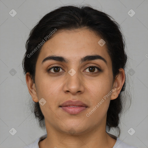 Joyful latino young-adult female with medium  brown hair and brown eyes