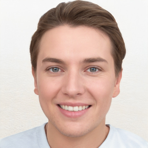 Joyful white young-adult female with short  brown hair and grey eyes