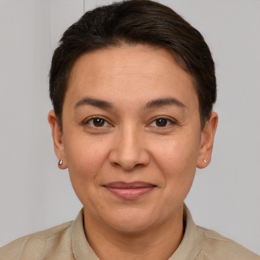 Joyful white adult female with short  brown hair and brown eyes