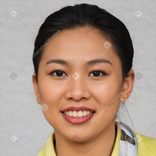 Joyful asian young-adult female with short  brown hair and brown eyes