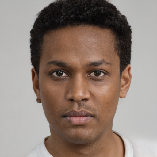 Neutral black young-adult male with short  brown hair and brown eyes
