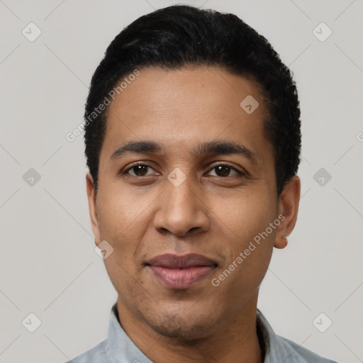 Joyful latino young-adult male with short  black hair and brown eyes