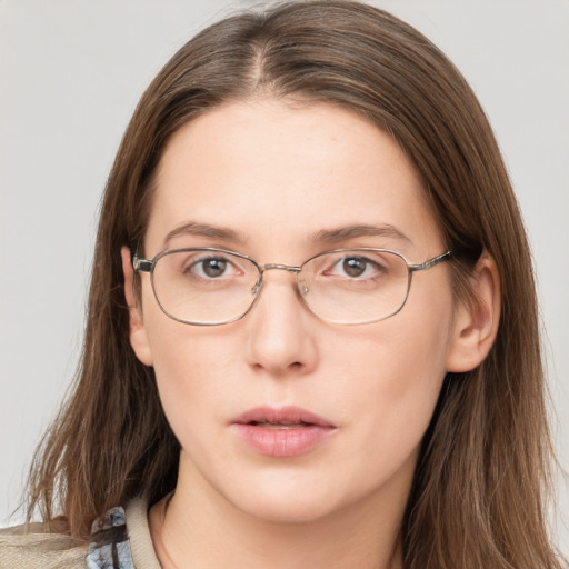 Neutral white adult female with long  brown hair and grey eyes