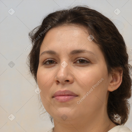 Joyful white adult female with medium  brown hair and brown eyes