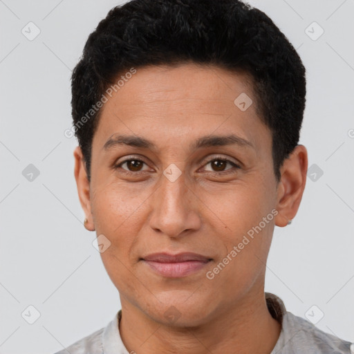 Joyful latino adult male with short  brown hair and brown eyes