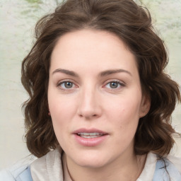 Joyful white young-adult female with medium  brown hair and green eyes