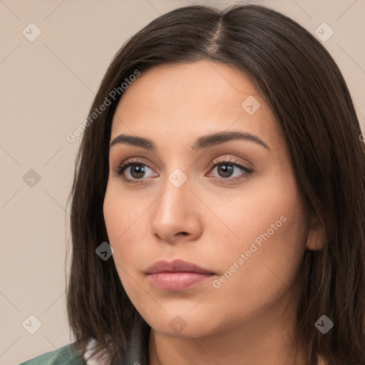 Neutral white young-adult female with long  brown hair and brown eyes