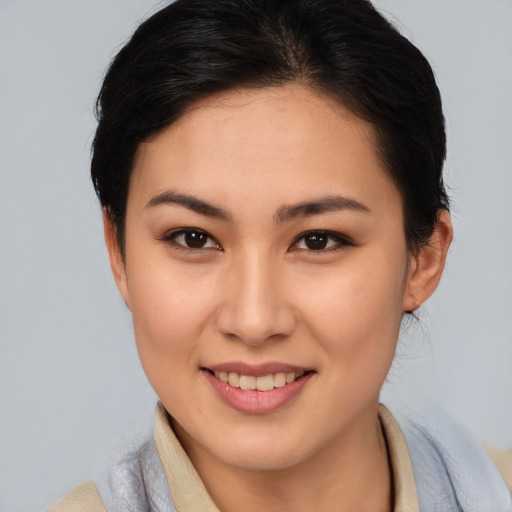 Joyful white young-adult female with medium  brown hair and brown eyes