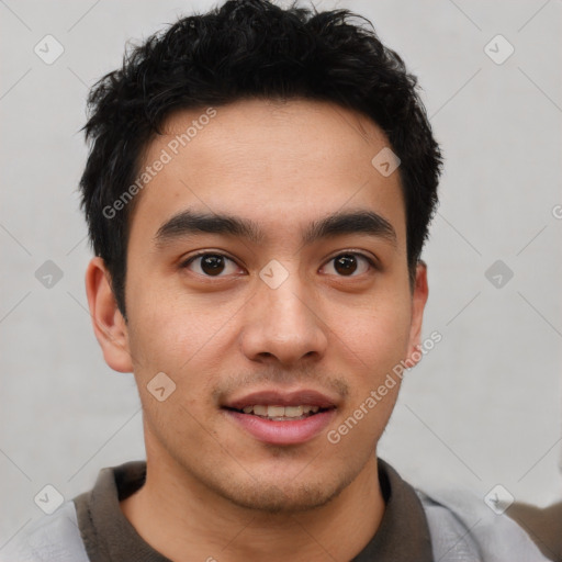 Joyful latino young-adult male with short  black hair and brown eyes