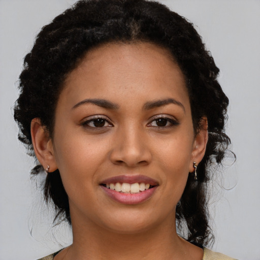 Joyful latino young-adult female with medium  black hair and brown eyes