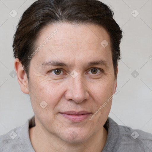 Joyful white adult male with short  brown hair and grey eyes