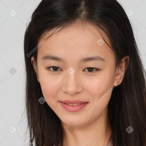 Joyful asian young-adult female with long  brown hair and brown eyes