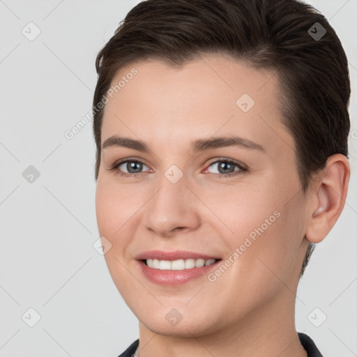 Joyful white young-adult female with short  brown hair and brown eyes