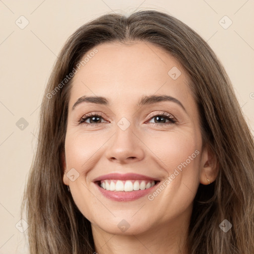 Joyful white young-adult female with long  brown hair and brown eyes