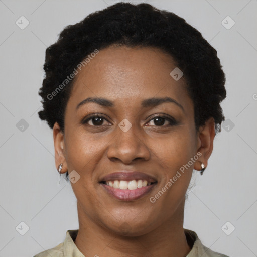 Joyful black young-adult female with short  black hair and brown eyes