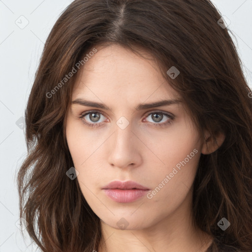 Neutral white young-adult female with long  brown hair and brown eyes