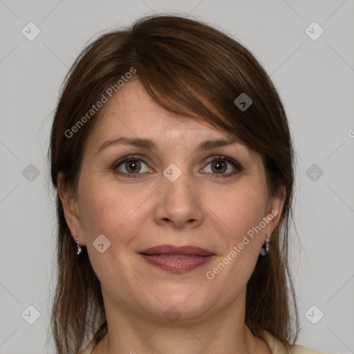 Joyful white adult female with medium  brown hair and grey eyes