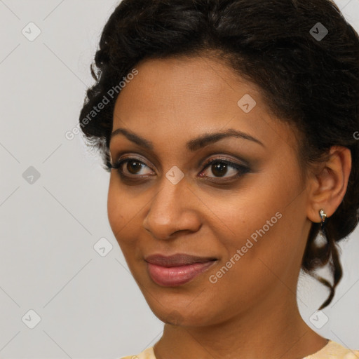 Joyful black young-adult female with short  brown hair and brown eyes