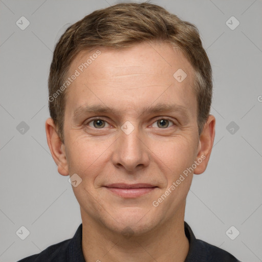 Joyful white adult male with short  brown hair and grey eyes