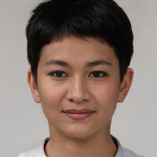 Joyful asian young-adult female with short  brown hair and brown eyes