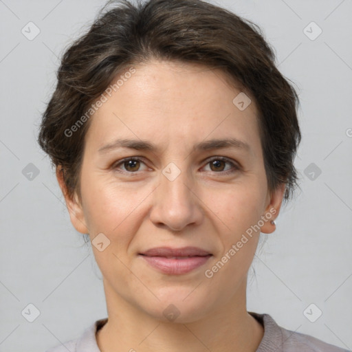 Joyful white adult female with medium  brown hair and brown eyes