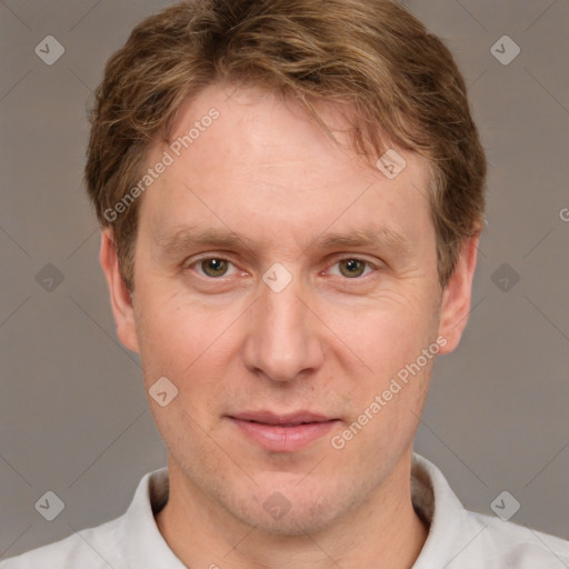 Joyful white adult male with short  brown hair and grey eyes