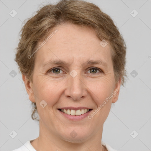 Joyful white adult female with short  brown hair and grey eyes