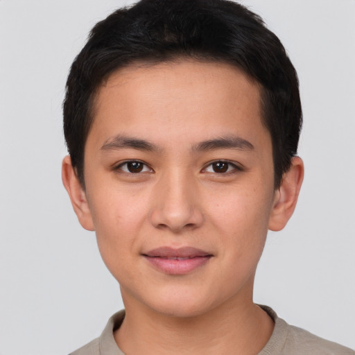 Joyful asian young-adult male with short  brown hair and brown eyes