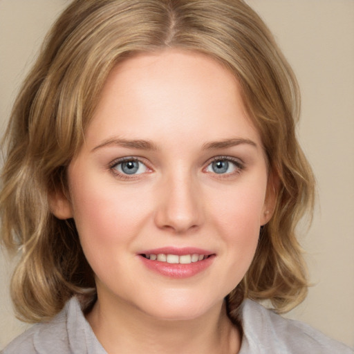 Joyful white young-adult female with medium  brown hair and blue eyes