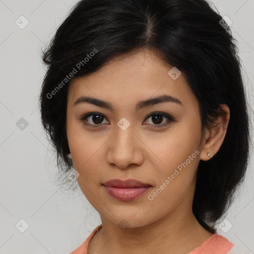 Joyful latino young-adult female with medium  brown hair and brown eyes