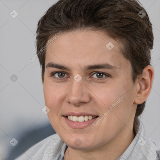 Joyful white young-adult female with short  brown hair and brown eyes