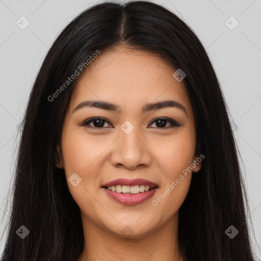 Joyful latino young-adult female with long  brown hair and brown eyes