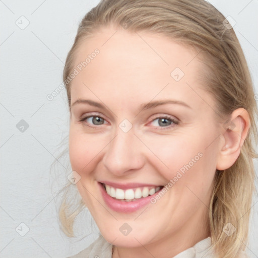 Joyful white young-adult female with medium  brown hair and blue eyes