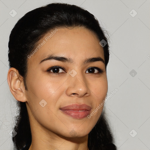 Joyful latino young-adult female with long  brown hair and brown eyes