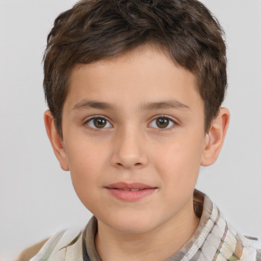 Joyful white child male with short  brown hair and brown eyes