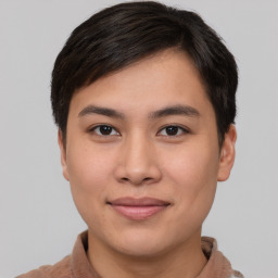 Joyful asian young-adult male with short  brown hair and brown eyes