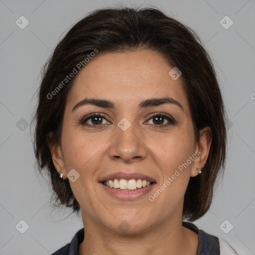 Joyful white adult female with medium  brown hair and brown eyes