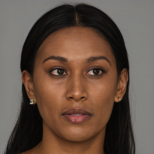 Neutral black young-adult female with long  brown hair and brown eyes
