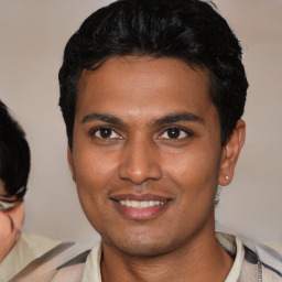 Joyful asian young-adult male with short  black hair and brown eyes