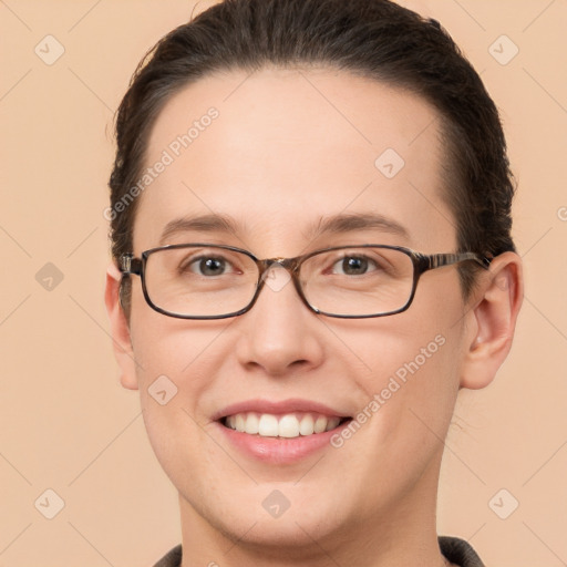 Joyful white young-adult female with short  brown hair and brown eyes