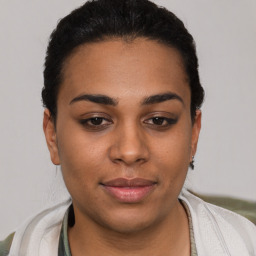 Joyful latino young-adult female with short  brown hair and brown eyes