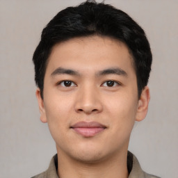 Joyful asian young-adult male with short  black hair and brown eyes